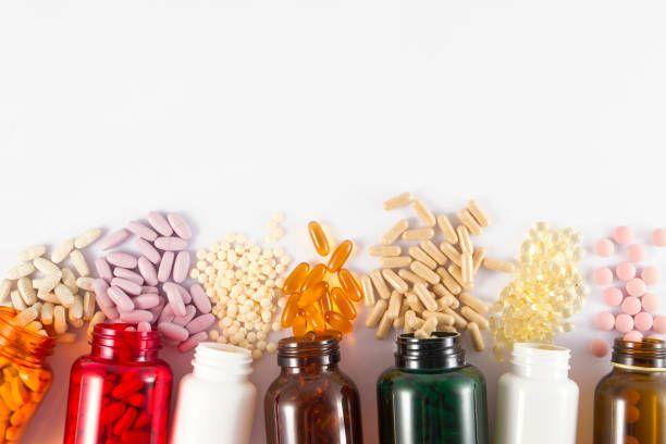 a row of medicine bottles on a white background