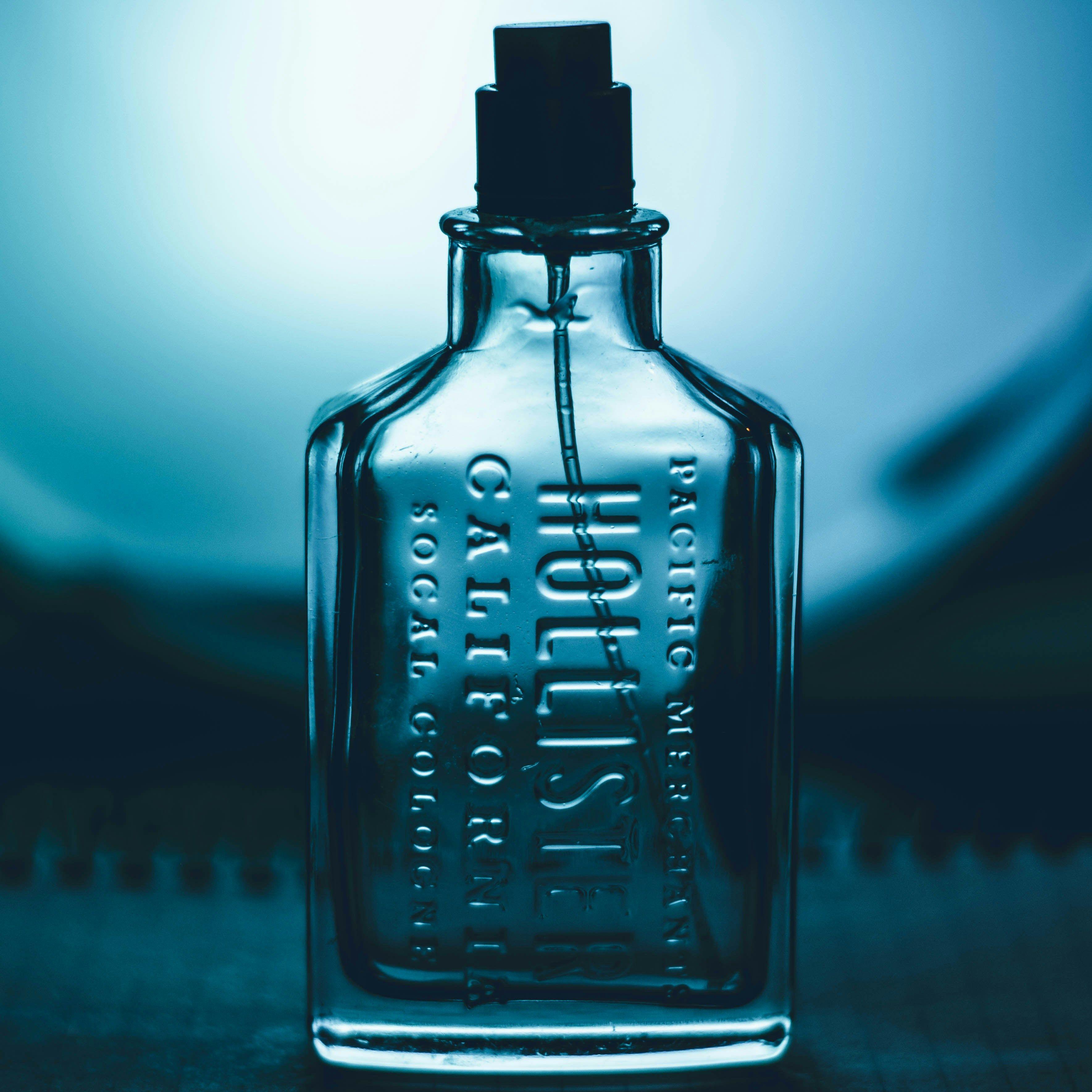 a bottle of cologne sitting on top of a table