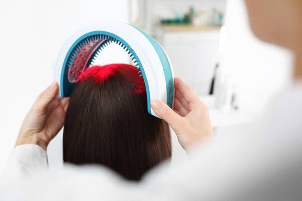 a woman is combing her hair with a comb