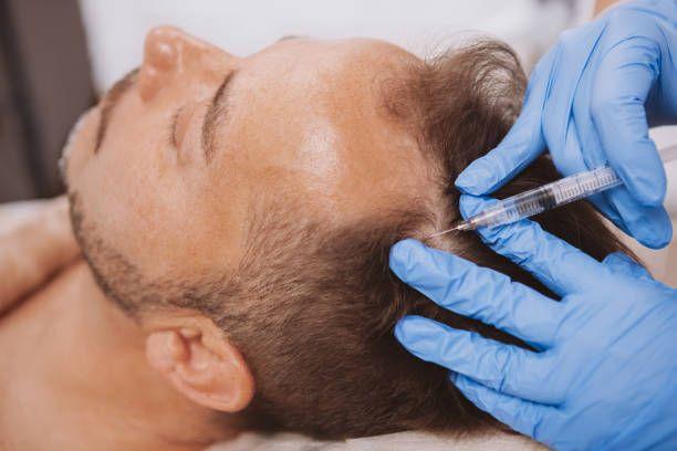 a man getting a syringe injected into his head